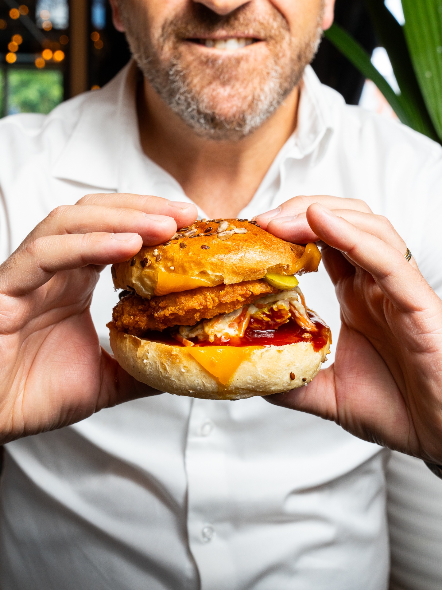 Customer enjoying a burger, perfect content for social media